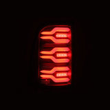 AlphaRex 19-21 Dodge Ram 1500 Luxx-Series LED Tail Lights Black w/Activ Light/Seq Signal - 640040