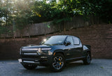 Rally Armor 22-25 Rivian R1T Black UR Mud Flap w/Tangerine Scream Logo - MF18-UR-BLK/TS