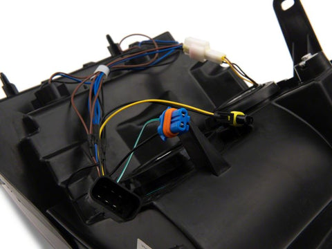 Raxiom 07-13 Chevrolet Silverado 1500 Axial Headlights w/ SEQL LED Bar- Blk Housing (Clear Lens) - S138004