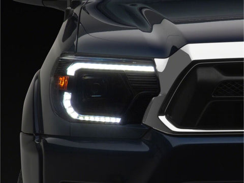 Raxiom 12-15 Toyota Tacoma Axial Series Switchback Projector Headlights- Black Housing- Clear Lens - TT23359