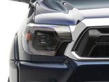 Raxiom 12-15 Toyota Tacoma Axial Series Switchback Projector Headlights- Black Housing- Clear Lens - TT23359