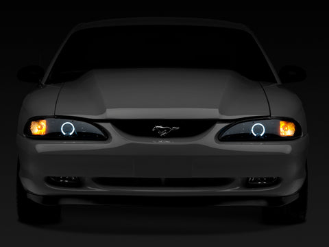 Raxiom 94-98 Ford Mustang LED Halo Projector Headlights- Black Housing (Smoked Lens) - 49119