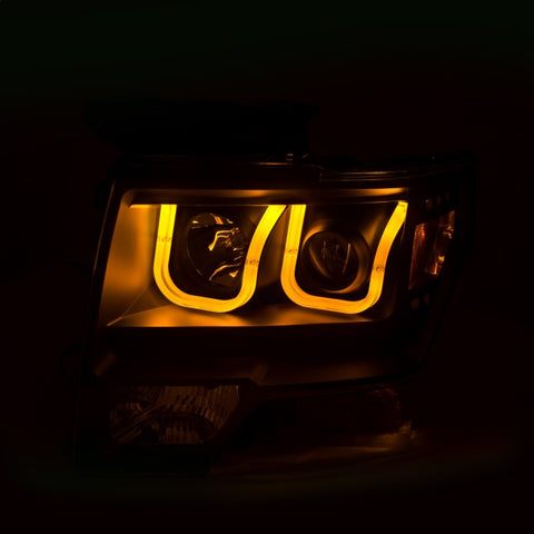 ANZO 2009-2014 Ford F-150 Projector Headlights w/ U-Bar Switchback Black w/ Amber - 111383