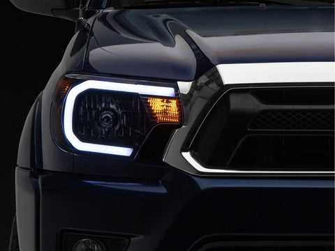 Raxiom 12-15 Toyota Tacoma Axial Series Headlights/Seq LED Bar- Black- Clear Lens - TT21848