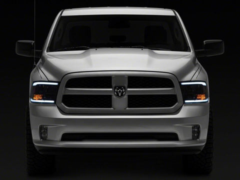 Raxiom 09-18 Dodge RAM 1500/2500/3500 Axial Headlights w/ SEQL LED Bar- Blk Housing (Clear Lens) - R131482