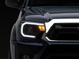 Raxiom 12-15 Toyota Tacoma Axial Series Headlights w/ LED Bar- Blk Housing (Clear Lens) - TT21847
