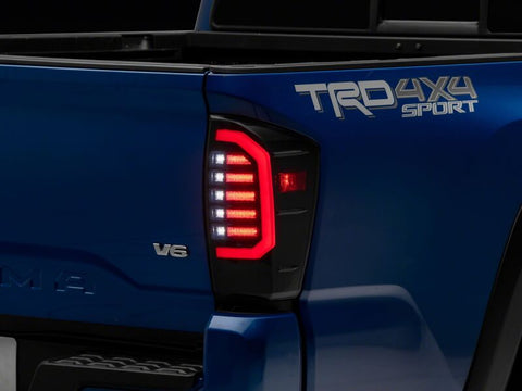 Raxiom 16-23 Toyota Tacoma Axial Series LED Tail Lights- Black Housing- Smoked Lens - TT36288