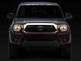 Raxiom 12-15 Toyota Tacoma Axial Series Headlights w/ LED Bar- Blk Housing (Clear Lens) - TT21847