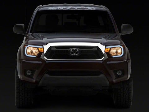 Raxiom 12-15 Toyota Tacoma Axial Series Headlights w/ LED Bar- Blk Housing (Clear Lens) - TT21847