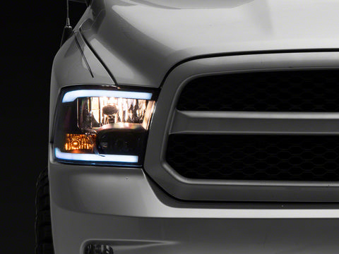 Raxiom 09-18 Dodge RAM 1500/2500/3500 Axial Headlights w/ SEQL LED Bar- Blk Housing (Clear Lens) - R131482