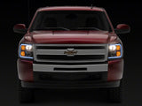 Raxiom 07-13 Chevrolet Silverado 1500 Axial Headlights w/ SEQL LED Bar- Blk Housing (Clear Lens) - S138004