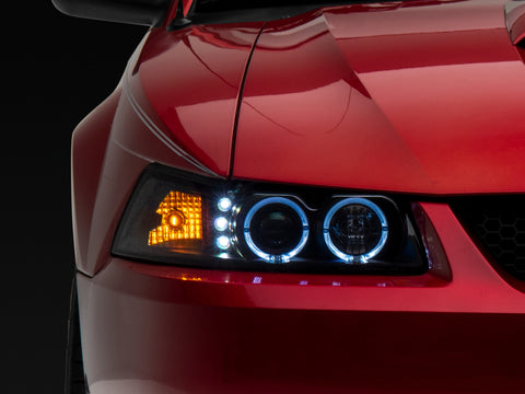 Raxiom 99-04 Ford Mustang Dual LED Halo Projector Headlights- Black Housing (Clear Lens) - 101684