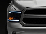 Raxiom 09-18 Dodge RAM 1500/2500/3500 Axial Series Headlights w/ LED Bar- Blk Housing (Clear Lens) - R131481