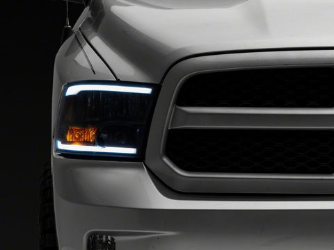 Raxiom 09-18 Dodge RAM 1500/2500/3500 Axial Series Headlights w/ LED Bar- Blk Housing (Clear Lens) - R131481