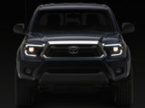 Raxiom 12-15 Toyota Tacoma Axial Series Switchback Projector Headlights- Black Housing- Clear Lens - TT23359
