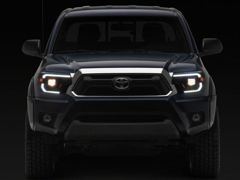 Raxiom 12-15 Toyota Tacoma Axial Series Switchback Projector Headlights- Black Housing- Clear Lens - TT23359