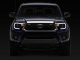 Raxiom 12-15 Toyota Tacoma Axial Series Headlights/Seq LED Bar- Black- Clear Lens - TT21848