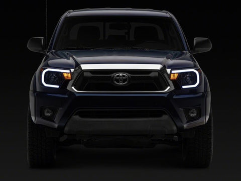 Raxiom 12-15 Toyota Tacoma Axial Series Headlights/Seq LED Bar- Black- Clear Lens - TT21848