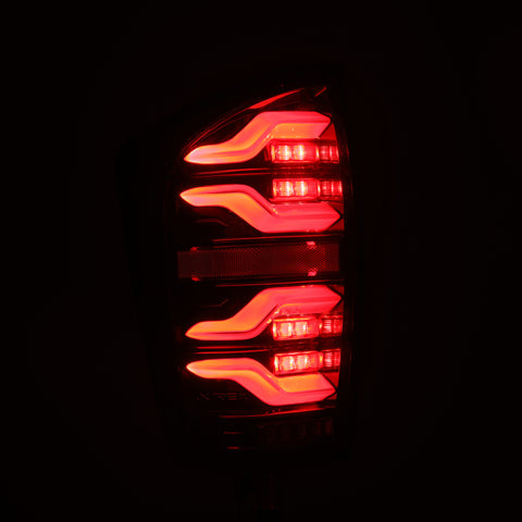 AlphaRex 16-21 Toyota Tacoma LUXX LED Taillights Alpha Blk w/Activ Light/Seq Signal - 680080
