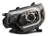 Raxiom 12-15 Toyota Tacoma Axial Series Projector Headlights w/ LED Bar- Blk Housing (Clear Lens) - TT21849