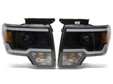 Raxiom 09-14 Ford F-150 Axial Series Projector Headlights w/ LED Light Bar- Blk Housing (Clear Lens) - T566369